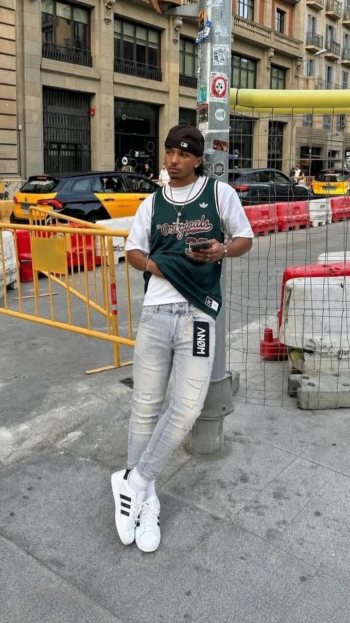 ANØM DENIM light-wash skinny jeans on model on a city street